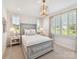Cozy bedroom with plush carpeting, neutral walls and natural light from the large window at 8115 Farm Crossing Ln # 3, Huntersville, NC 28078