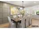 Elegant dining room with a statement wall and hardwood floors at 8115 Farm Crossing Ln # 3, Huntersville, NC 28078
