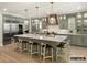Modern kitchen with green cabinets and a large island at 8115 Farm Crossing Ln # 3, Huntersville, NC 28078