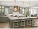 Modern kitchen with green cabinets and a large island at 8115 Farm Crossing Ln # 3, Huntersville, NC 28078