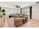 Spacious living room with a large sectional sofa, ceiling fan, and abundant natural light at 8115 Farm Crossing Ln # 3, Huntersville, NC 28078