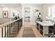Bright and airy office space with two work stations and a view of a living area at 8115 Farm Crossing Ln # 3, Huntersville, NC 28078