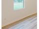 Bright room showcasing light wood flooring and a large window offering ample natural light at 649 Kitfox Nw Dr, Concord, NC 28027