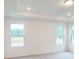 Bedroom with plush carpeting and windows overlooking the water at 649 Kitfox Nw Dr, Concord, NC 28027