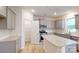 Modern kitchen with granite countertops, stainless steel appliances, and ample cabinet space at 649 Kitfox Nw Dr, Concord, NC 28027