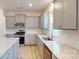 Modern kitchen featuring granite countertops, stainless steel appliances, and white subway tile backsplash at 649 Kitfox Nw Dr, Concord, NC 28027