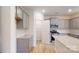 Modern kitchen with gray cabinets, granite countertops, stainless steel appliances, and walk-in pantry at 649 Kitfox Nw Dr, Concord, NC 28027