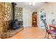 Stone fireplace and built-in shelving in dining area at 713 Perkins St, Lowell, NC 28098
