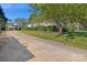 Long driveway leading to a carport and charming house at 713 Perkins St, Lowell, NC 28098