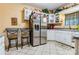 Galley kitchen with white cabinets and stainless steel appliances at 713 Perkins St, Lowell, NC 28098