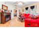Living room with red sectional sofa and fireplace at 713 Perkins St, Lowell, NC 28098