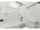 Bright bathroom featuring a tub-shower combo with matte black hardware and a white toilet at 2025 Parks Rd, Salisbury, NC 28147