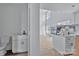Bathroom area with toilet, vanity, and view into a spacious room filled with light at 2025 Parks Rd, Salisbury, NC 28147