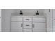 Close-up of a double vanity with modern black fixtures, offering a sleek and stylish design at 2025 Parks Rd, Salisbury, NC 28147