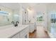 Bright bathroom with double sink vanity, white cabinets, and large glass enclosed shower at 2025 Parks Rd, Salisbury, NC 28147