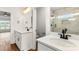 Elegant bathroom boasts double sinks, white cabinets, and a beautifully tiled shower at 2025 Parks Rd, Salisbury, NC 28147