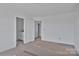 Bright bedroom featuring white walls and trim, with a doorway to an ensuite bathroom at 2025 Parks Rd, Salisbury, NC 28147