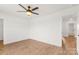 Bright bedroom features a ceiling fan, hardwood floors, and neutral paint at 2025 Parks Rd, Salisbury, NC 28147