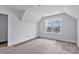 Upstairs bedroom with a large window providing natural light, complemented by modern flooring at 2025 Parks Rd, Salisbury, NC 28147