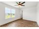 Comfortable bedroom with a ceiling fan and a large window offering a scenic view at 2025 Parks Rd, Salisbury, NC 28147