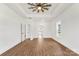Large bedroom with a ceiling fan, natural lighting, and beautiful floors at 2025 Parks Rd, Salisbury, NC 28147