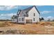 New construction home with an attached two-car garage and a classic white exterior at 2025 Parks Rd, Salisbury, NC 28147
