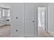Hallway to kitchen featuring white door and access to other rooms in the home at 2025 Parks Rd, Salisbury, NC 28147