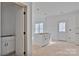 Open-concept kitchen with a center island, white cabinets, and lots of natural light, ready for personalization at 2025 Parks Rd, Salisbury, NC 28147