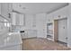 Bright kitchen with white cabinets, marble countertops, and stainless steel appliances at 2025 Parks Rd, Salisbury, NC 28147