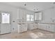 Bright kitchen featuring white cabinets, plenty of natural light, and a functional layout at 2025 Parks Rd, Salisbury, NC 28147