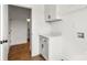 Well-lit laundry room with storage cabinets and washer/dryer hookups at 2025 Parks Rd, Salisbury, NC 28147