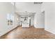 Spacious living room with tall ceilings open to the kitchen, featuring beautiful hardwood floors and large windows at 2025 Parks Rd, Salisbury, NC 28147