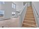 Bright living room with staircase and large windows offering an abundance of natural light at 2025 Parks Rd, Salisbury, NC 28147