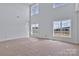 Light-filled living room featuring soaring ceilings and large windows for a modern, open feel at 2025 Parks Rd, Salisbury, NC 28147