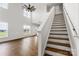 Open living room with two story ceiling, large windows, and staircase at 2025 Parks Rd, Salisbury, NC 28147