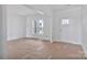 Inviting living room featuring a large window that offers plenty of natural light and a neutral color palette at 2025 Parks Rd, Salisbury, NC 28147