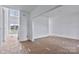 Bright living space features a large open entry area, natural light, and an unfinished floor at 2025 Parks Rd, Salisbury, NC 28147