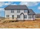 Two-story home with gray siding, black trim, and a new deck for outdoor enjoyment at 2025 Parks Rd, Salisbury, NC 28147