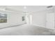 Spacious main bedroom featuring plush carpet, tray ceiling, and large windows providing ample natural light at 317 Miramar Dr, York, SC 29745