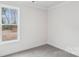 Neutral carpeted bedroom features view to outside from large window at 317 Miramar Dr, York, SC 29745