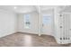 Bright entryway features wood-look floors, large windows, and a front door with glass panels at 317 Miramar Dr, York, SC 29745
