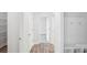 Hallway with wood-look floors and white doors, leading to other rooms in the home at 317 Miramar Dr, York, SC 29745