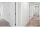 Hallway featuring carpet and several closed, white doors at 317 Miramar Dr, York, SC 29745