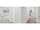 Bright hallway featuring neutral carpet and several doorways at 317 Miramar Dr, York, SC 29745