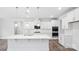 Bright kitchen boasts quartz countertops, stainless steel appliances, and sleek, white cabinetry at 317 Miramar Dr, York, SC 29745