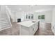 Open concept kitchen with island, stainless steel appliances, and wood-look floors at 317 Miramar Dr, York, SC 29745