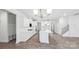Spacious, white kitchen offers ample counter space, stainless steel appliances, and modern pendant lighting at 317 Miramar Dr, York, SC 29745