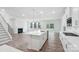Open-concept kitchen features a large island, stainless steel sink, and seamlessly connects to the living space at 317 Miramar Dr, York, SC 29745
