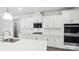 Modern kitchen with white cabinets, granite countertops, and stainless steel appliances at 317 Miramar Dr, York, SC 29745