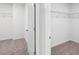 White walk-in closet featuring wire shelving and neutral carpet at 317 Miramar Dr, York, SC 29745